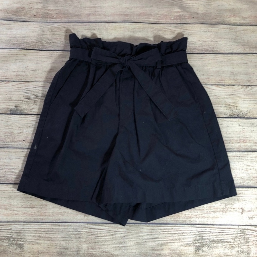 Navy paper bag high waisted shorts.